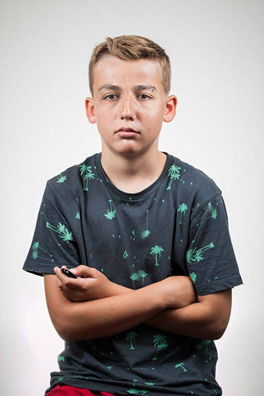 Felix Ossa - Symbiosis - Image of a boy. Some parts of his face have been merged with those of a man